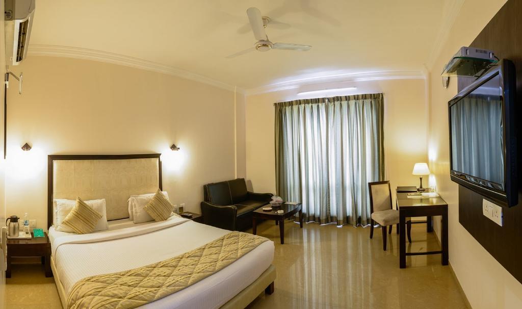 Quality Inn Palms Gandhidham Bilik gambar